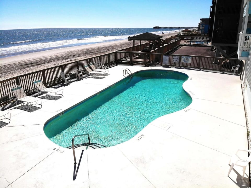 Pool on the beach with loungers, so you get a swim and the ocean view together.