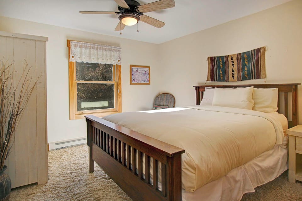 Guest bedroom with Queen bed and attached bathroom.