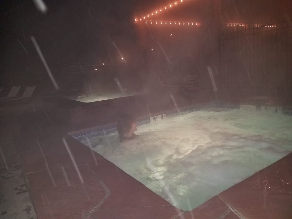 Hot tub in a snowstorm, who needs an icebath when this is available, and warm