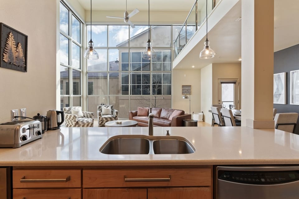 The kitchen is conveniently located next to both the living room and dining area, perfect for cooking and entertaining! | The Hillside, Brian Head, Utah | Voyax Luxury Vacation Rentals