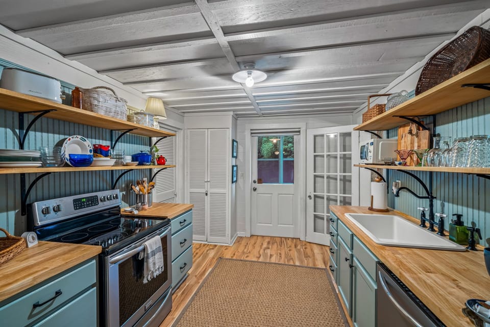 Open kitchen between bunk room and back sunroom porch