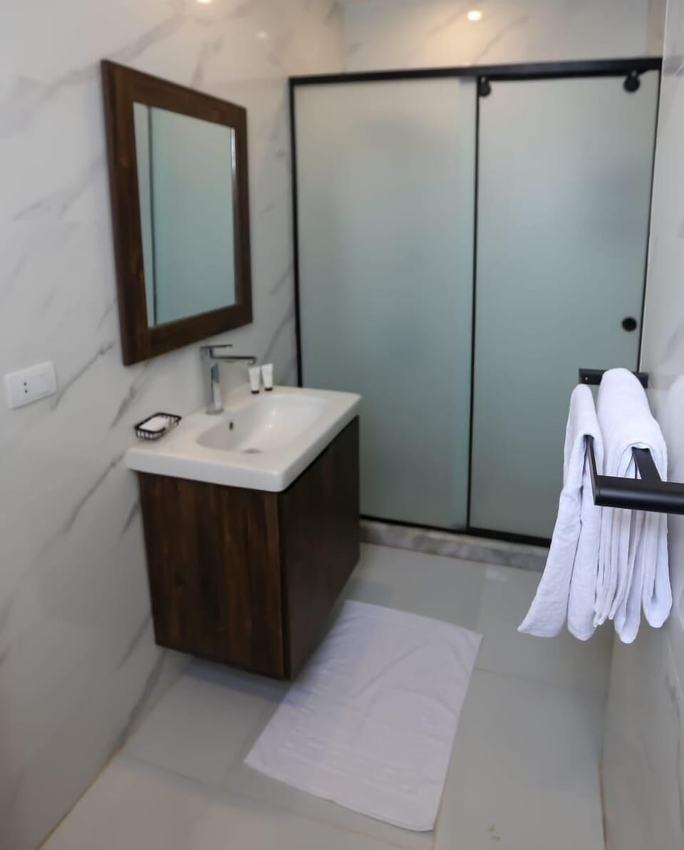 Deluxe Double Room, Balcony, Mountain View | Bathroom | Separate tub and shower, hair dryer, slippers, towels