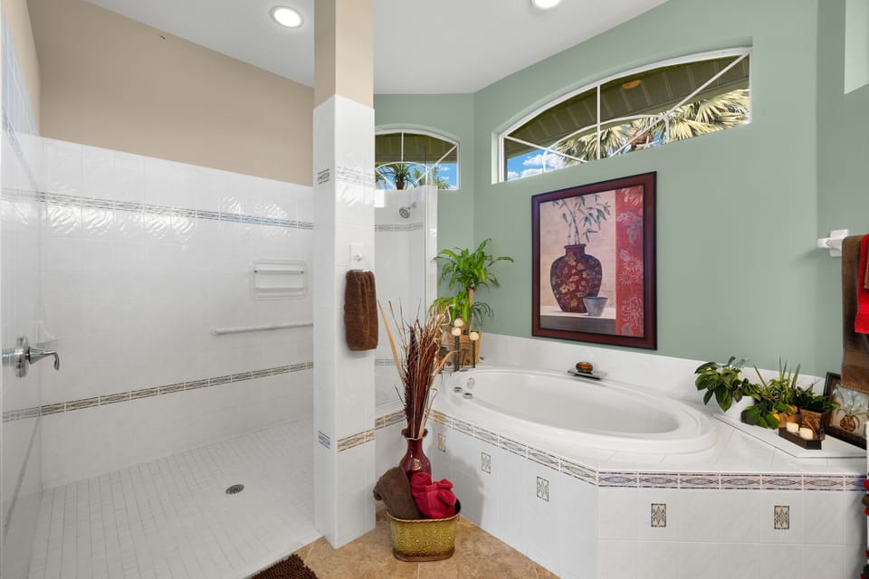 The primary bathroom's large walk-in shower and soaking tub offer a spa-like retreat.