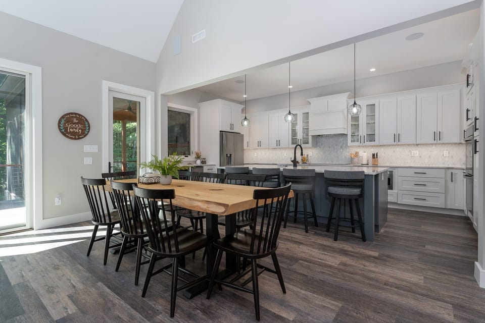 Island seating for 4 and open-concept dining area for 8