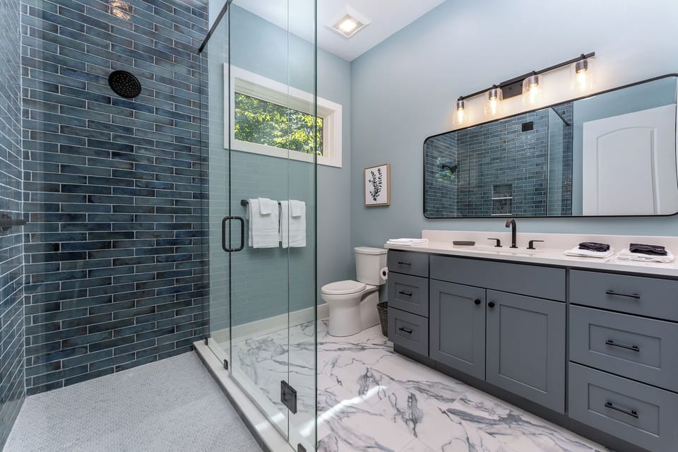 En suite bath with walk-in shower.