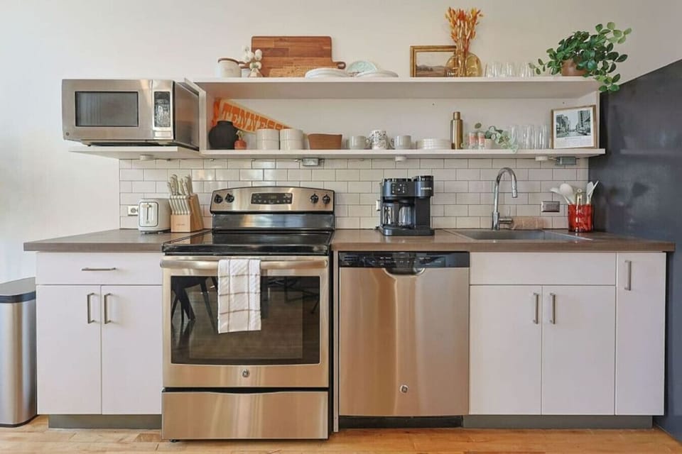 Kitchen: Whip up culinary delights in this stylish, modern kitchen with stainless steel appliances!