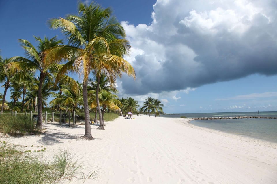 Work on your tan at beautiful Smathers Beach in Key West.