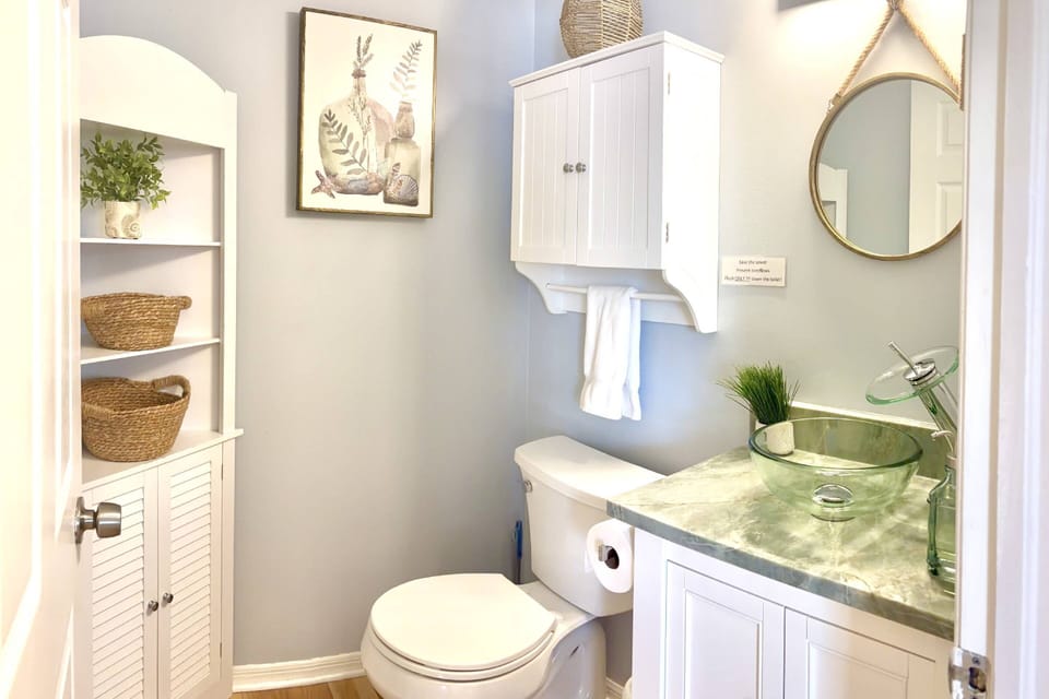The convenient first-floor half bath at Castaway Cove provides easy access for guests, adding extra comfort and functionality during your stay.