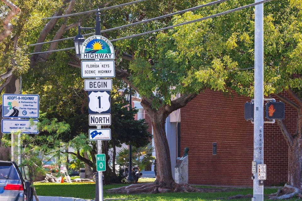 Take a picture at the 0 mile marker.