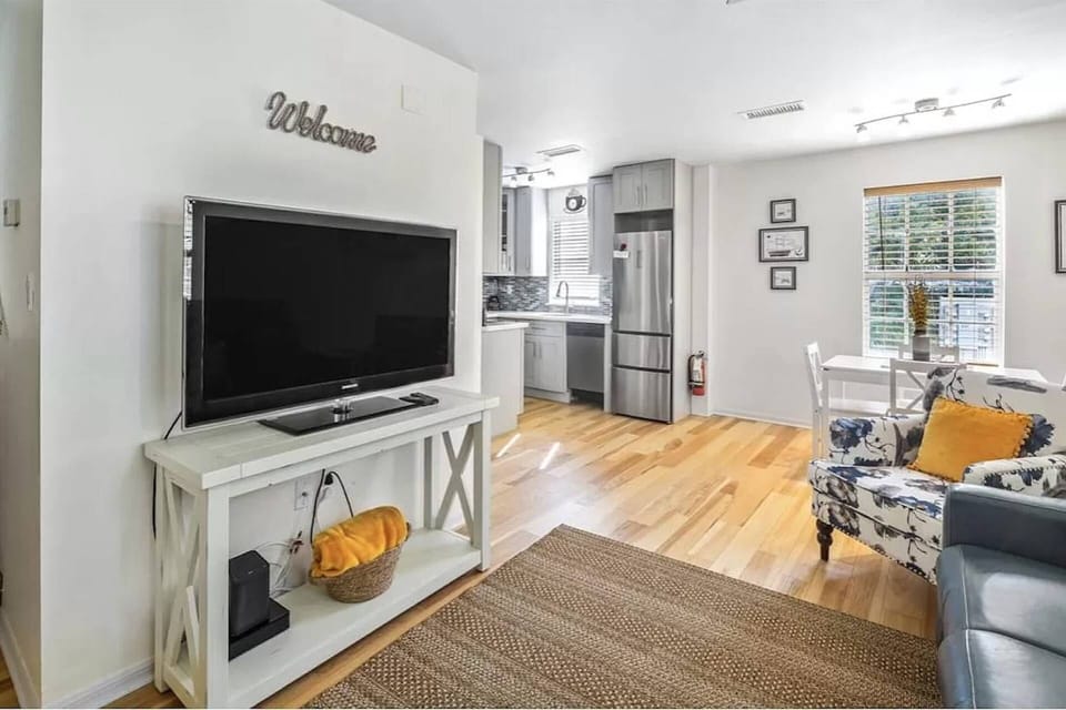 The open floor plan at Castaway Cove seamlessly connects the living room to the kitchen, creating a spacious and inviting area.