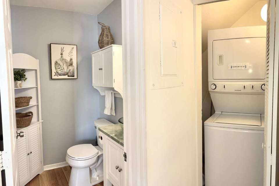 The convenient laundry on the first floor at Castaway Cove simplifies your stay, making it easy to freshen up your clothes without hassle.