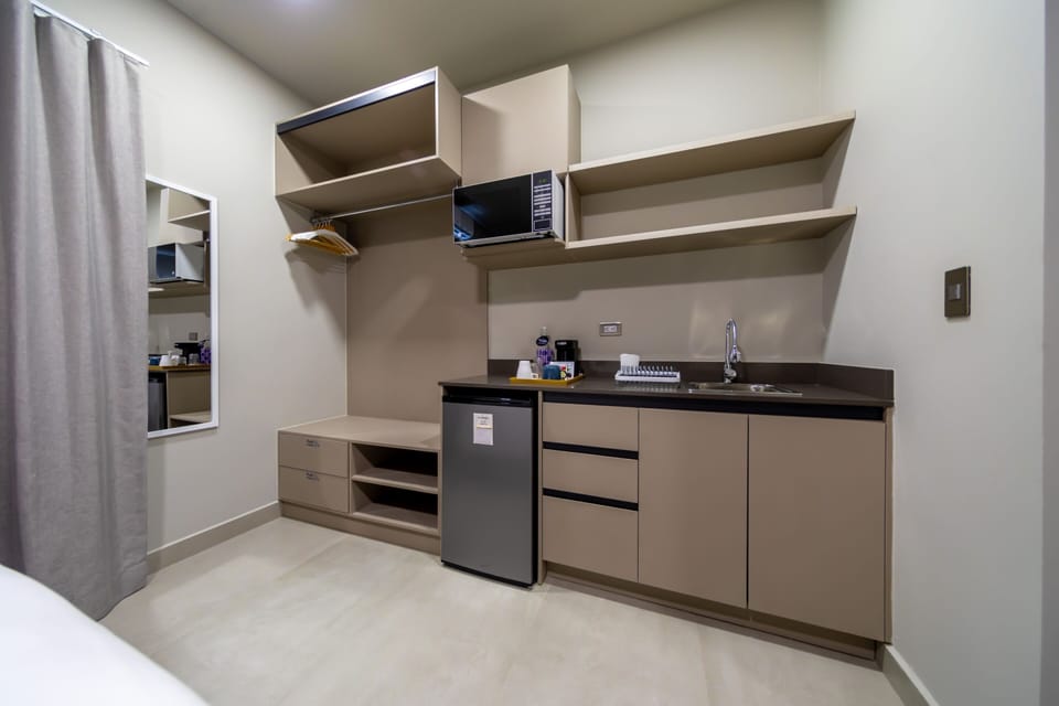 Signature Suite, Private Bathroom, Garden View (Suite Junior 1.06) | Private kitchenette | Coffee/tea maker, mini-fridge, microwave