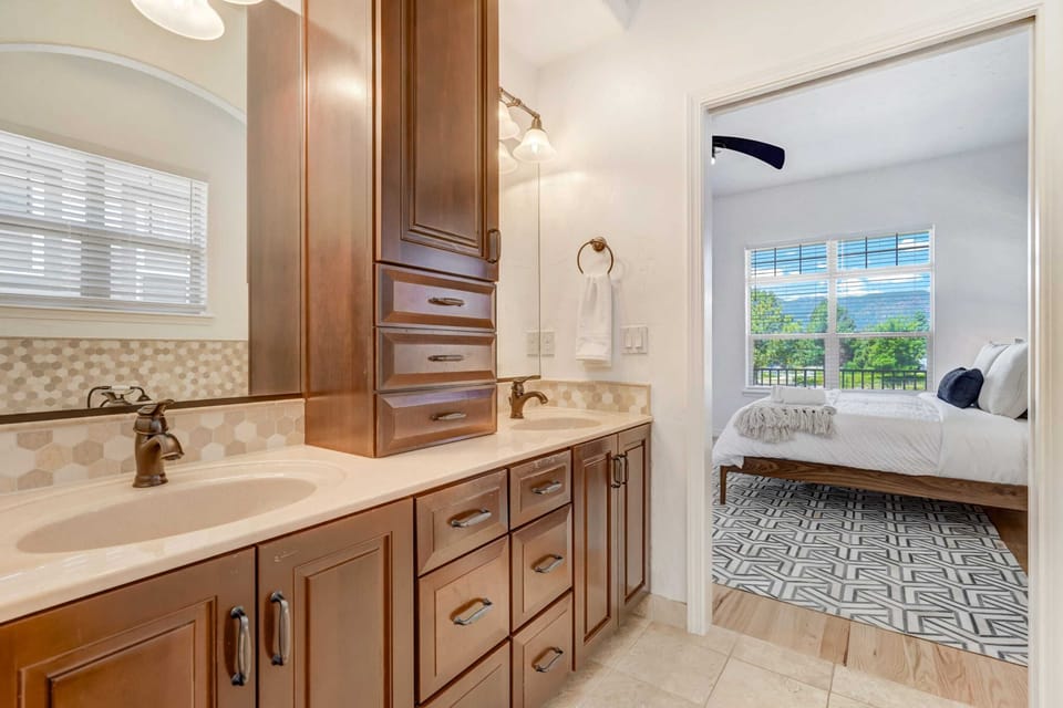 Luxurious master bathroom with a soaking tub, dual sinks, and a spacious walk-in shower.