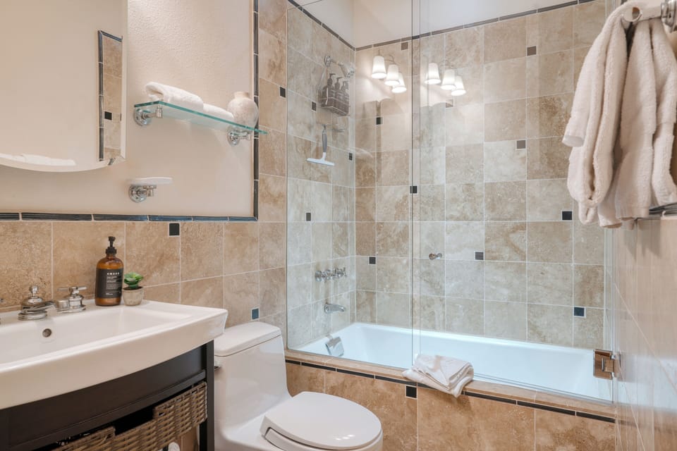 Bedroom 2's ensuite bathroom offers a shower/tub combo.