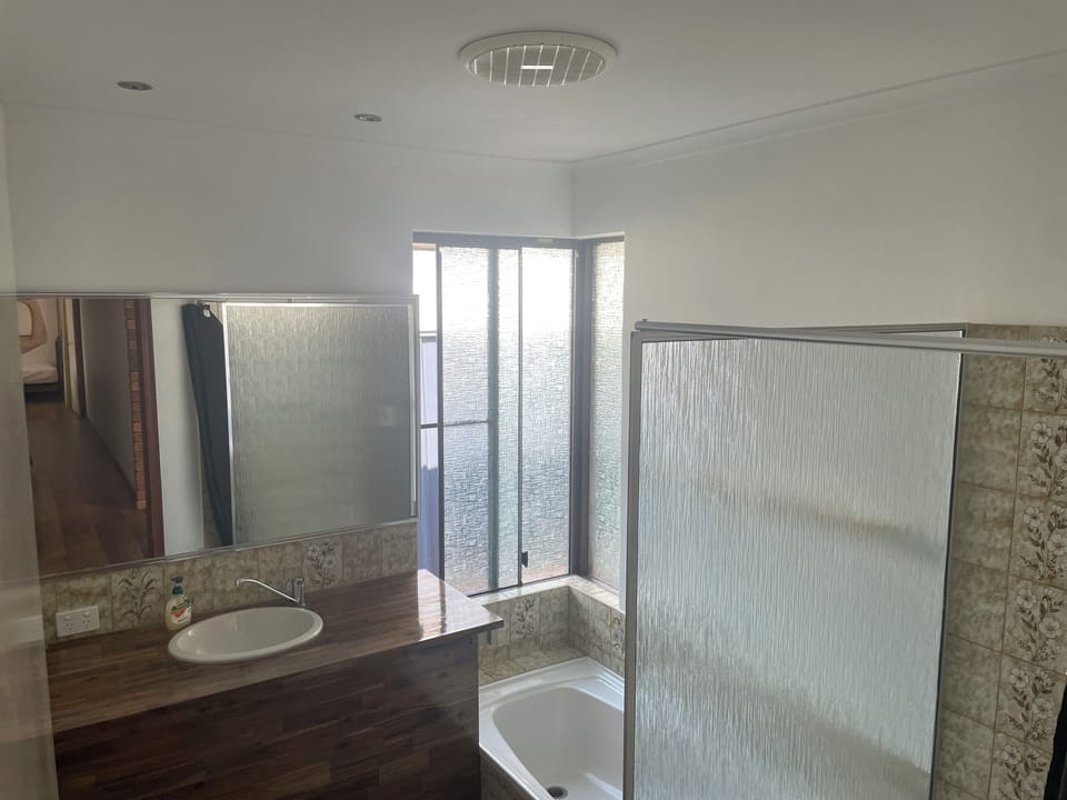Bathroom. One of 2 at house. This one has shower and bath.