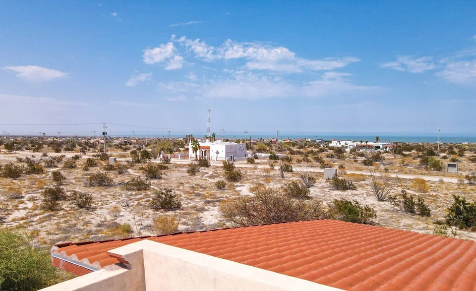 Overlook the garden and patio from the terrace at Casa Susie. A great spot for morning coffee or an afternoon read, capturing the essence of indoor-outdoor Baja living.