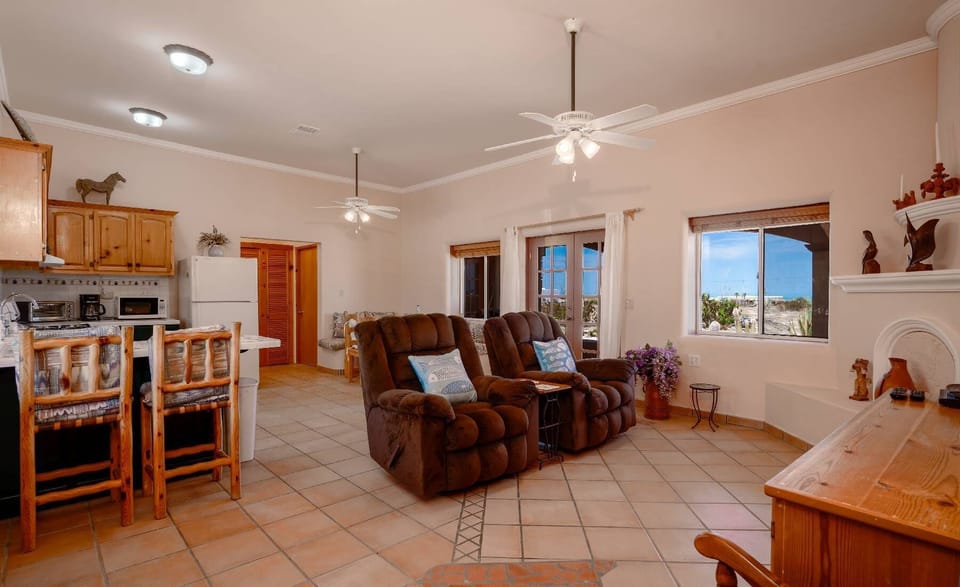 Sink into the comfortable sofa in the big living room at Casa Susie — perfect for movie nights or relaxing after a day at the heated pool