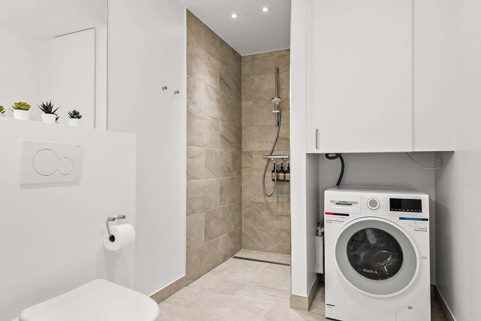 Bathroom with free combo washer / dryer access