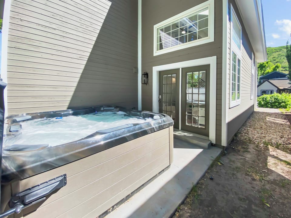 Relax under the trees in your private outdoor hot tub, a soothing retreat after exploring the mountains of Park City.