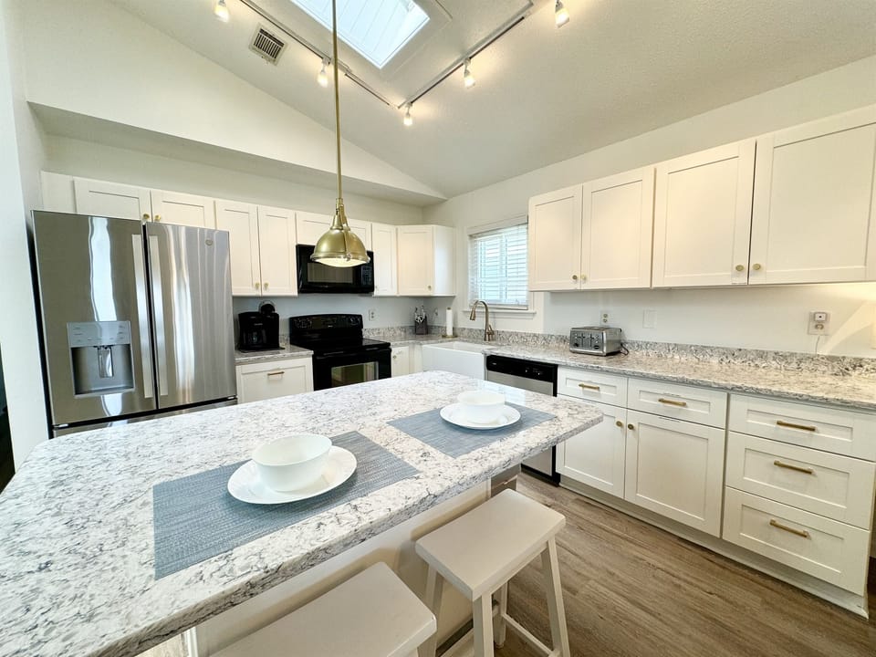 Enjoy the beautifully updated living areas.  Shaker cabinets & quartz countertops!