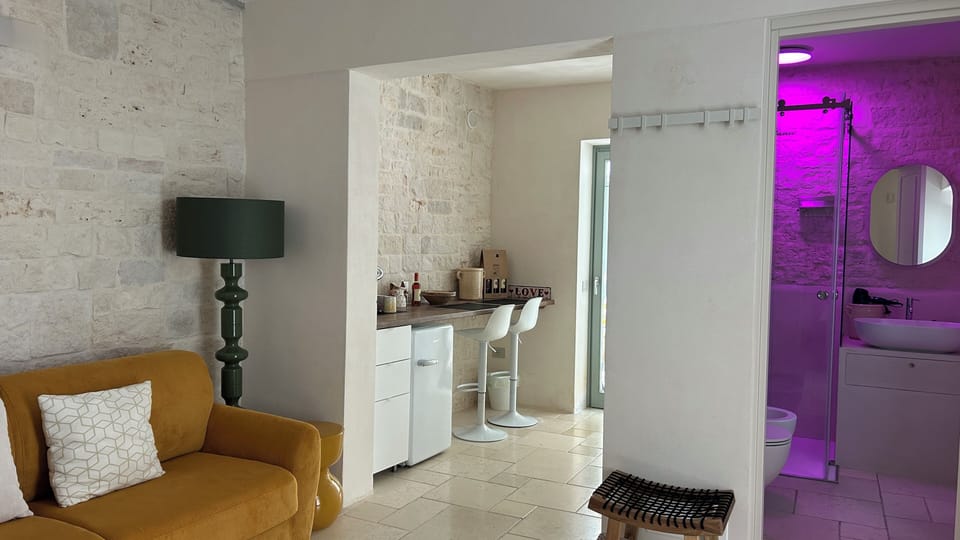 Deluxe Suite, Private Bathroom, Courtyard View | Living area | 43-inch Smart TV with satellite channels