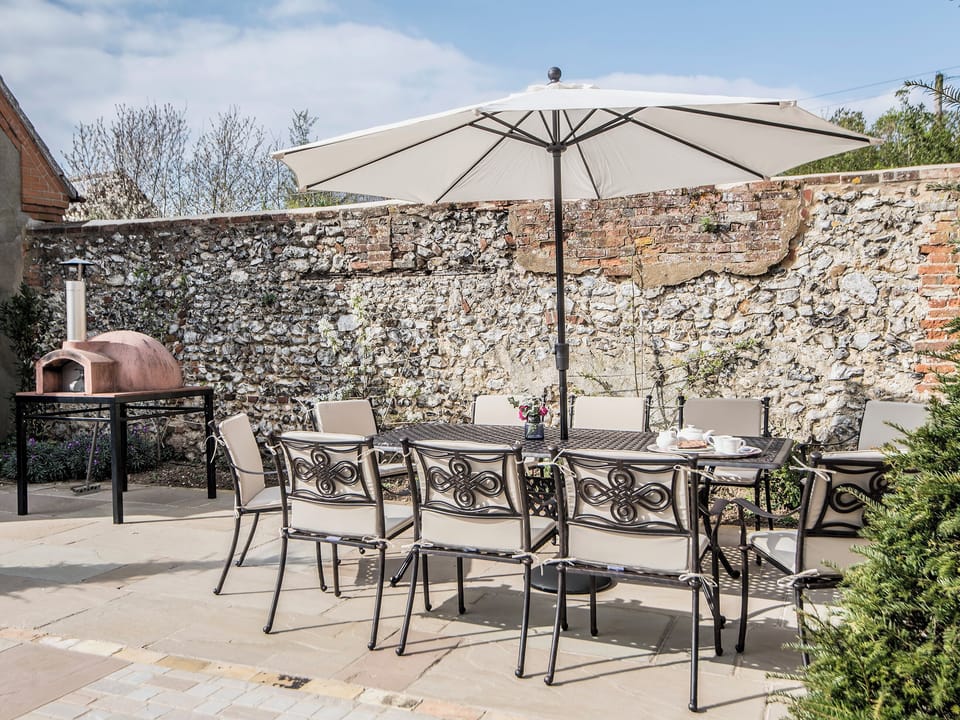 Enclosed garden complete with furniture and a pizza oven | The Manor House, Syderstone, near Fakenham