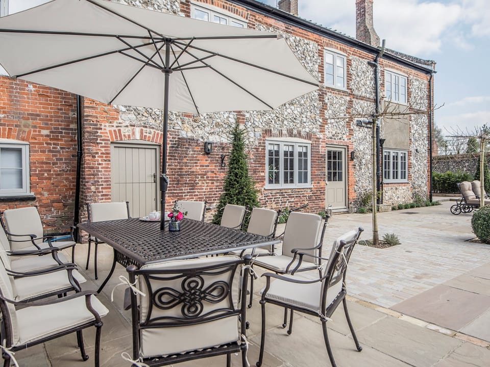 Tranquil garden with furniture. Perfect for al fresco dining | The Manor House, Syderstone, near Fakenham