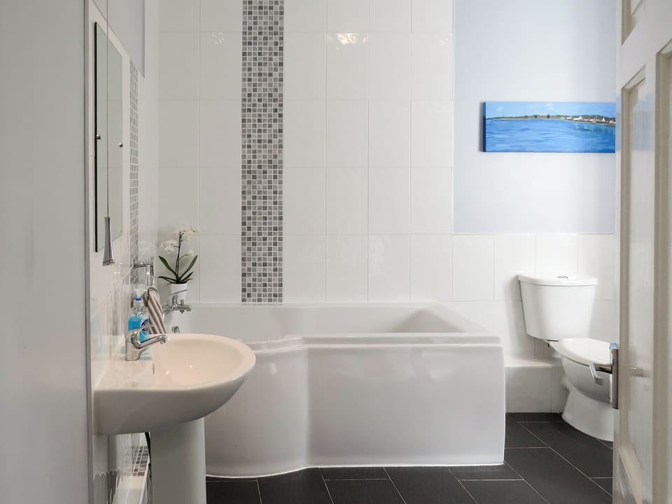 Family bathroom with bath and separate shower cubicle | Fisherman&rsquo;s Cottage, Stairhaven by Glenluce