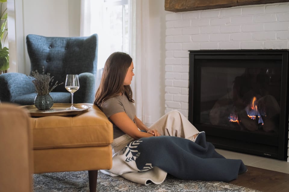 Curly up by the cozy fireplace and let its warm glow melt away your stress. 