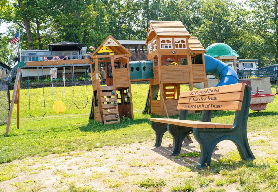 Playground for children under 10 years old, bench to watch them from.