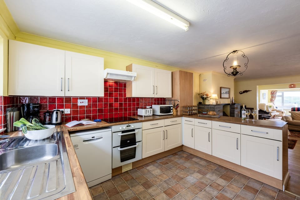 Stradav, Polzeath. Second Floor: With an electric oven and hob, fridge/freezer, microwave and dishwasher