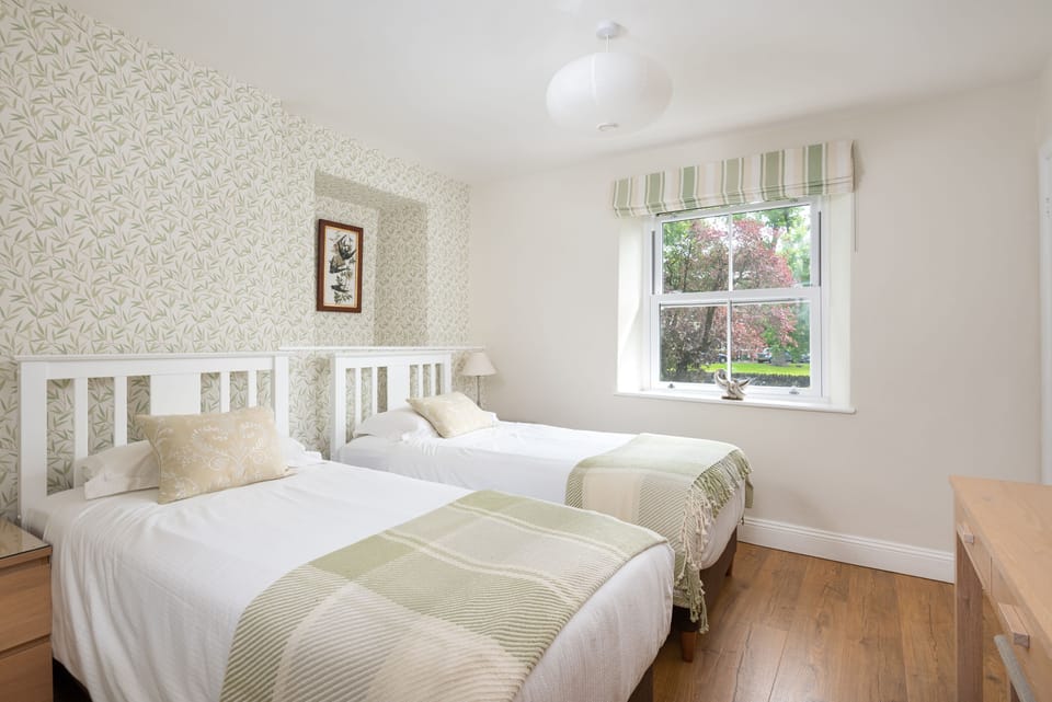 Light and airy twin bedroom with views to Walla Crag