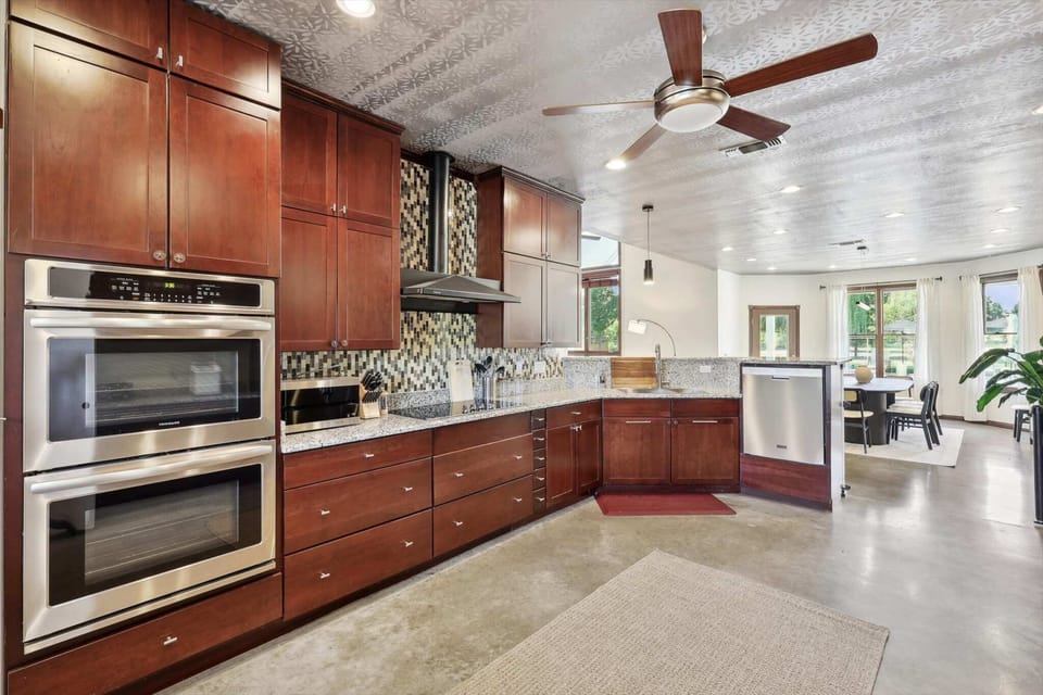 Fully equipped kitchen with modern appliances and ample space.