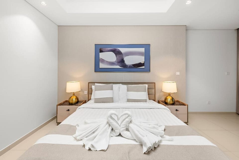 Bedroom: Elegant decor and warm lighting create a peaceful retreat in Dubai!