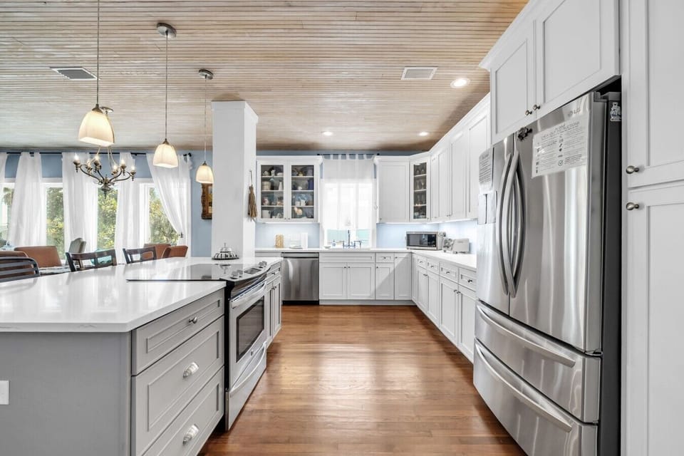 Beautiful new kitchen with new stainless steel appliances and countertops.