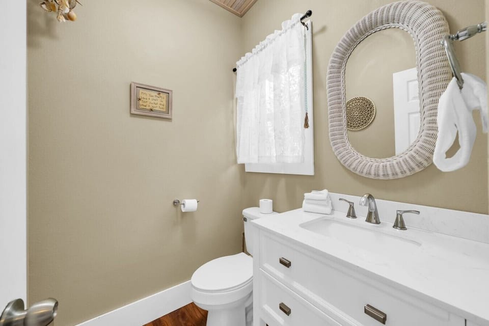 Half bath conveniently located just off the kitchen.
