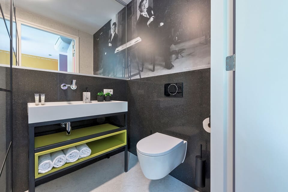 Spotlessly clean bathroom with modern fixtures and fresh, crisp towels. 