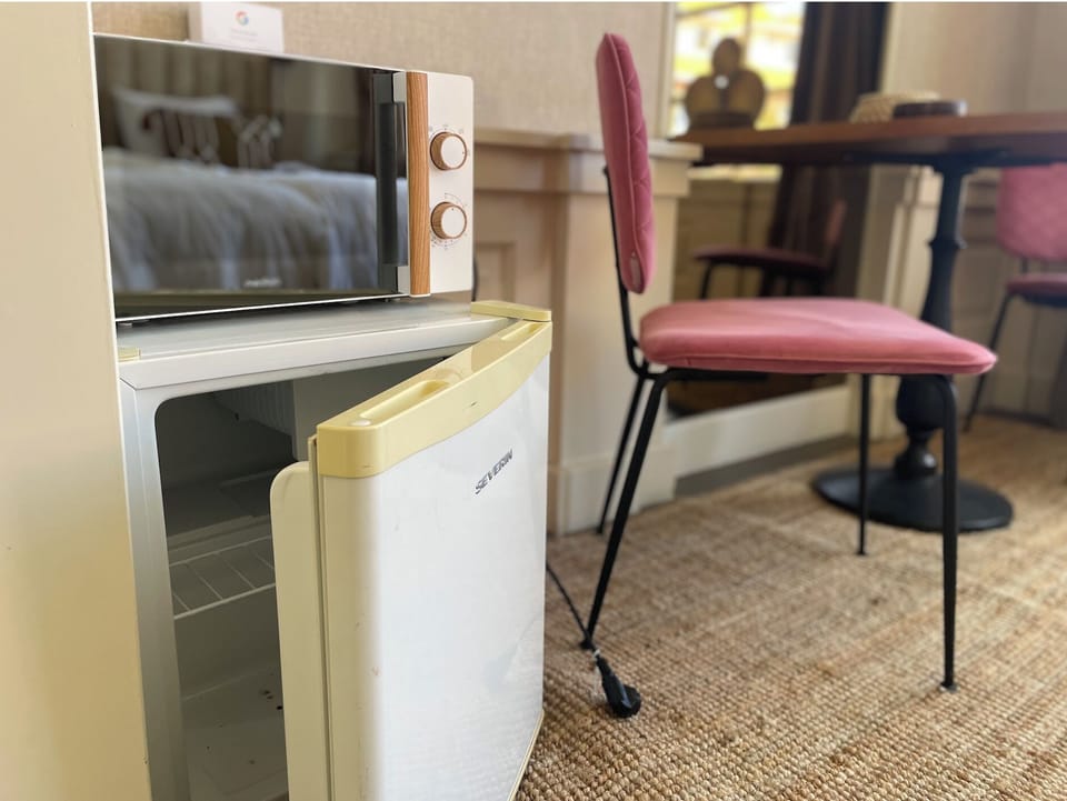 Practical mini fridge for drinks and snacks during your stay.