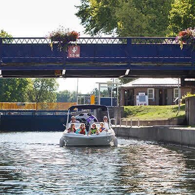 Boating through the Trent-Severn Waterway at Lock 32 — A quintessential Bobcaygeon summer experience.