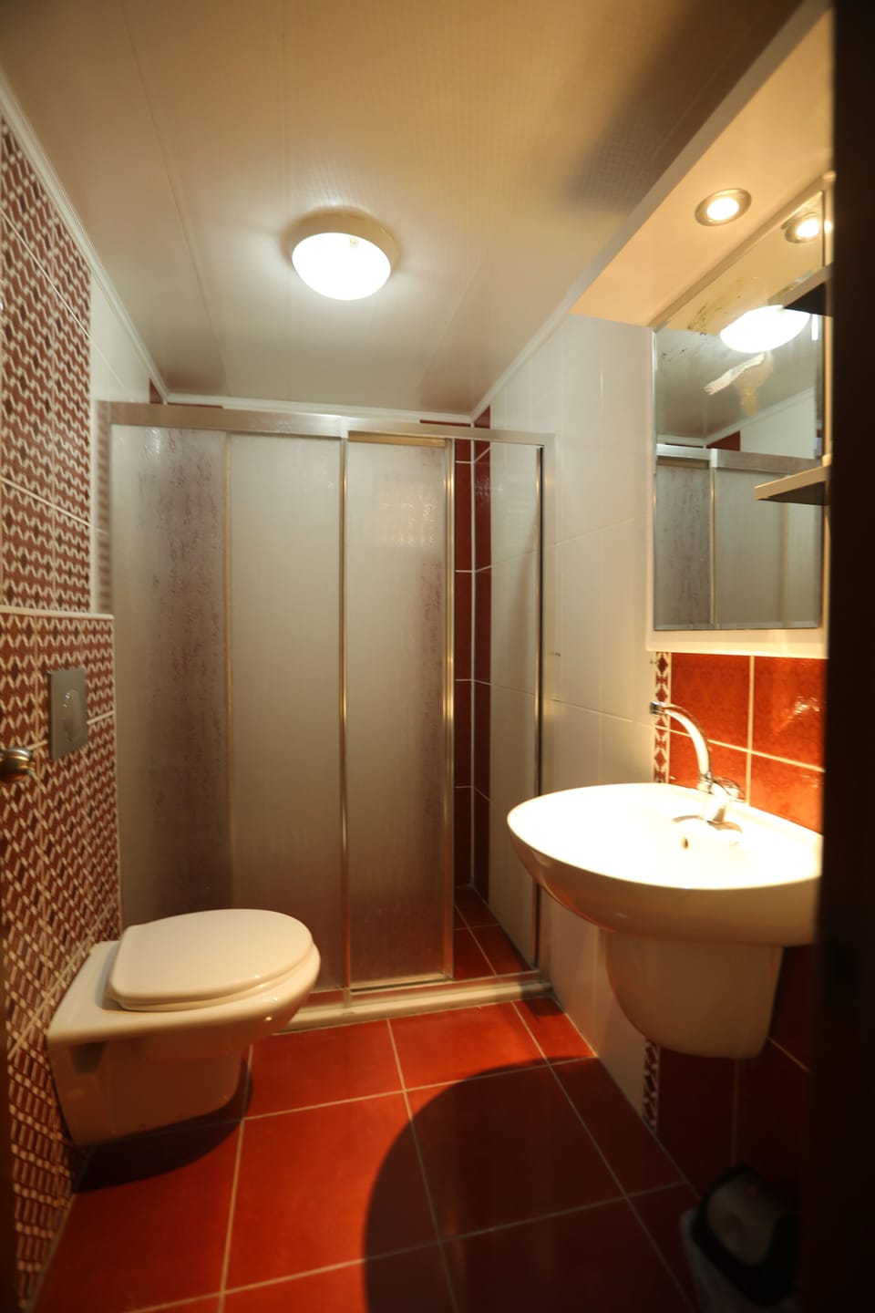 Shower, hair dryer, slippers, towels