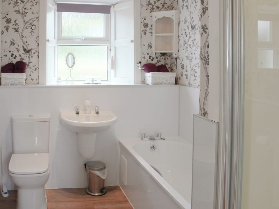 Bathroom with bath and separate shower cubicle | Palmallet Cottage, Whithorn
