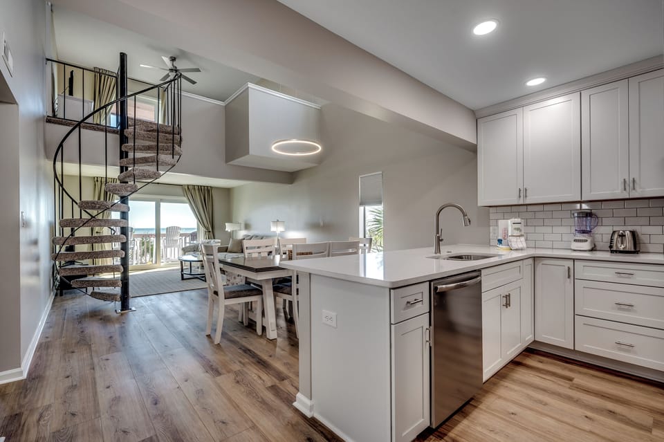 Kitchen to dining view with soaring ceilings