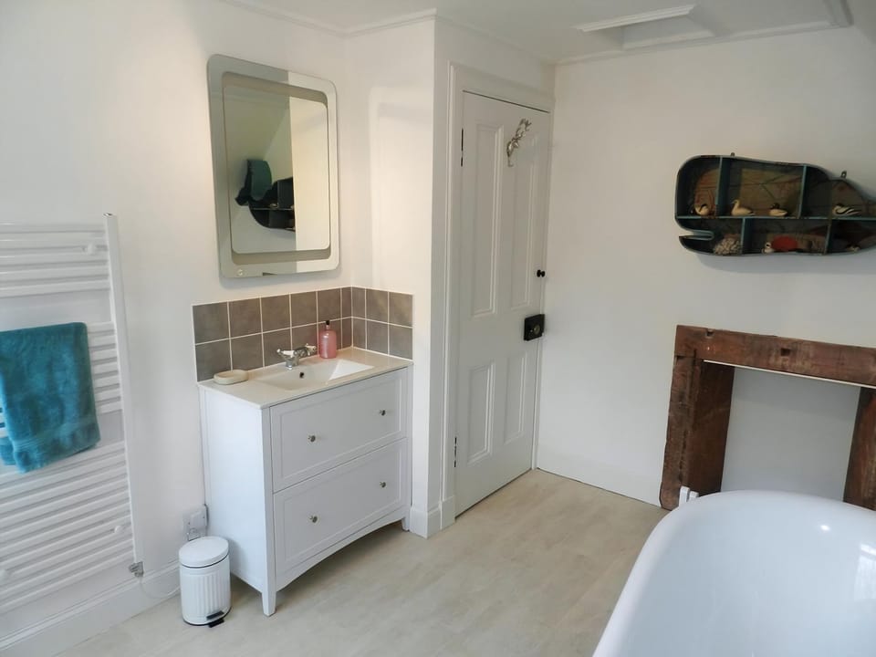 Bathroom with roll-top bath | Craegard House, Corrie, Isle of Arran