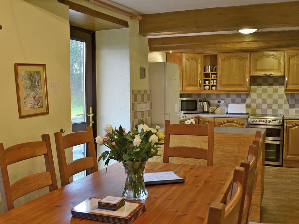 Delightful dining area with door leading to garden | Rosemary - Sherrill Farm Holiday Cottages, Dunterton, near Tavistock