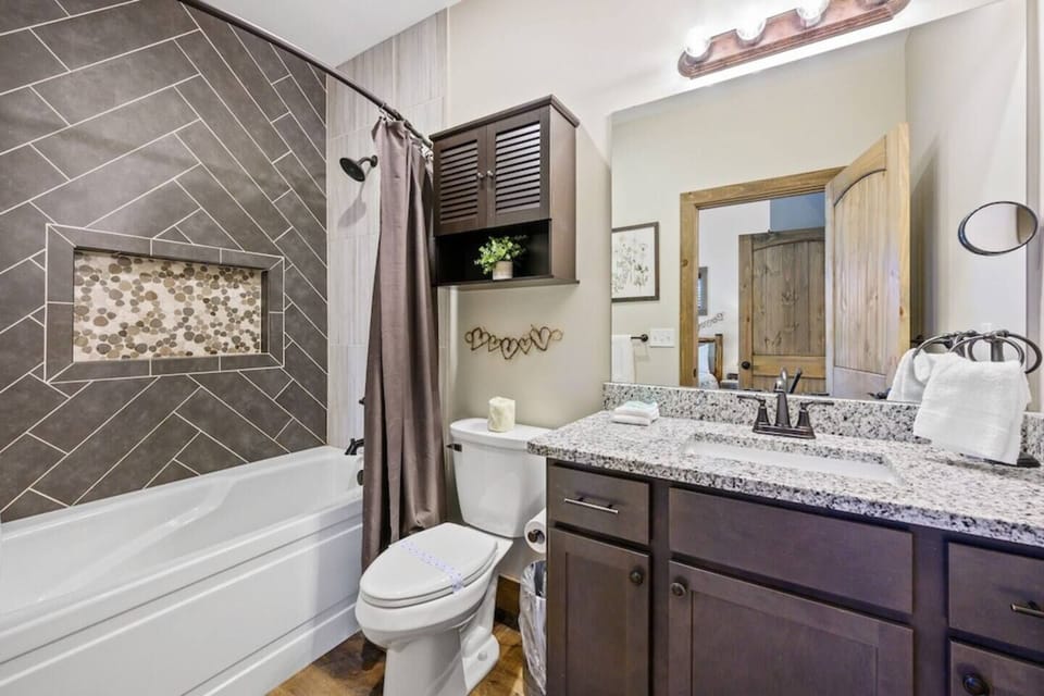 Spacious entry level master bathroom with bathtub!
