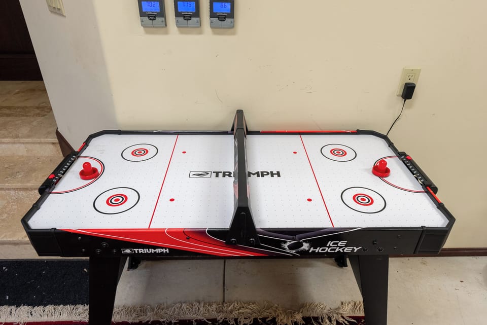 Air hockey in the game room