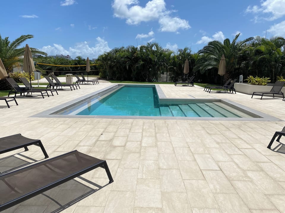 Free launch chairs and umbrellas around the pool