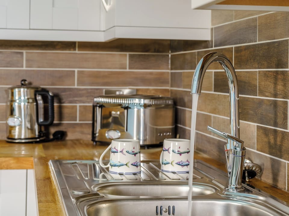 Well-equipped kitchen | The Cowshed - Musselwick Farm, St Brides