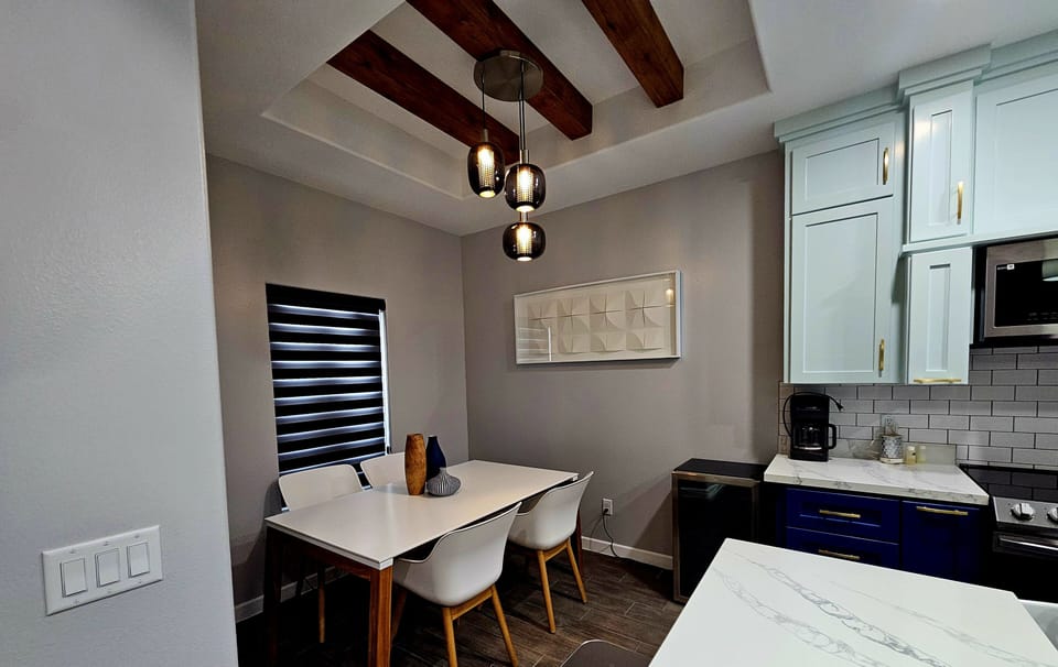 Dining table sits 4 and extra chairs in counter top 