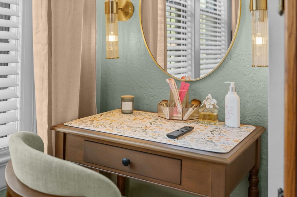 Boutique-hotel details that make getting ready feel like part of the vacation. Primary bedroom vanity nook includes outlet underneath. 